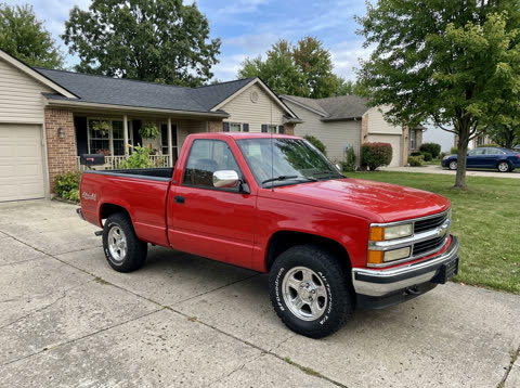 Phone photo of a red pickup truck